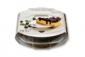   Cheesecake with a layer of tasty biscuits, covered with blueberry jam