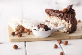 Hazelnut meringue cake with cocoa cream and chocolate