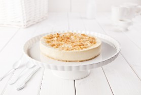   Classic backed cheesecake with a layer of tasty biscuits, decorated with peanut crisps